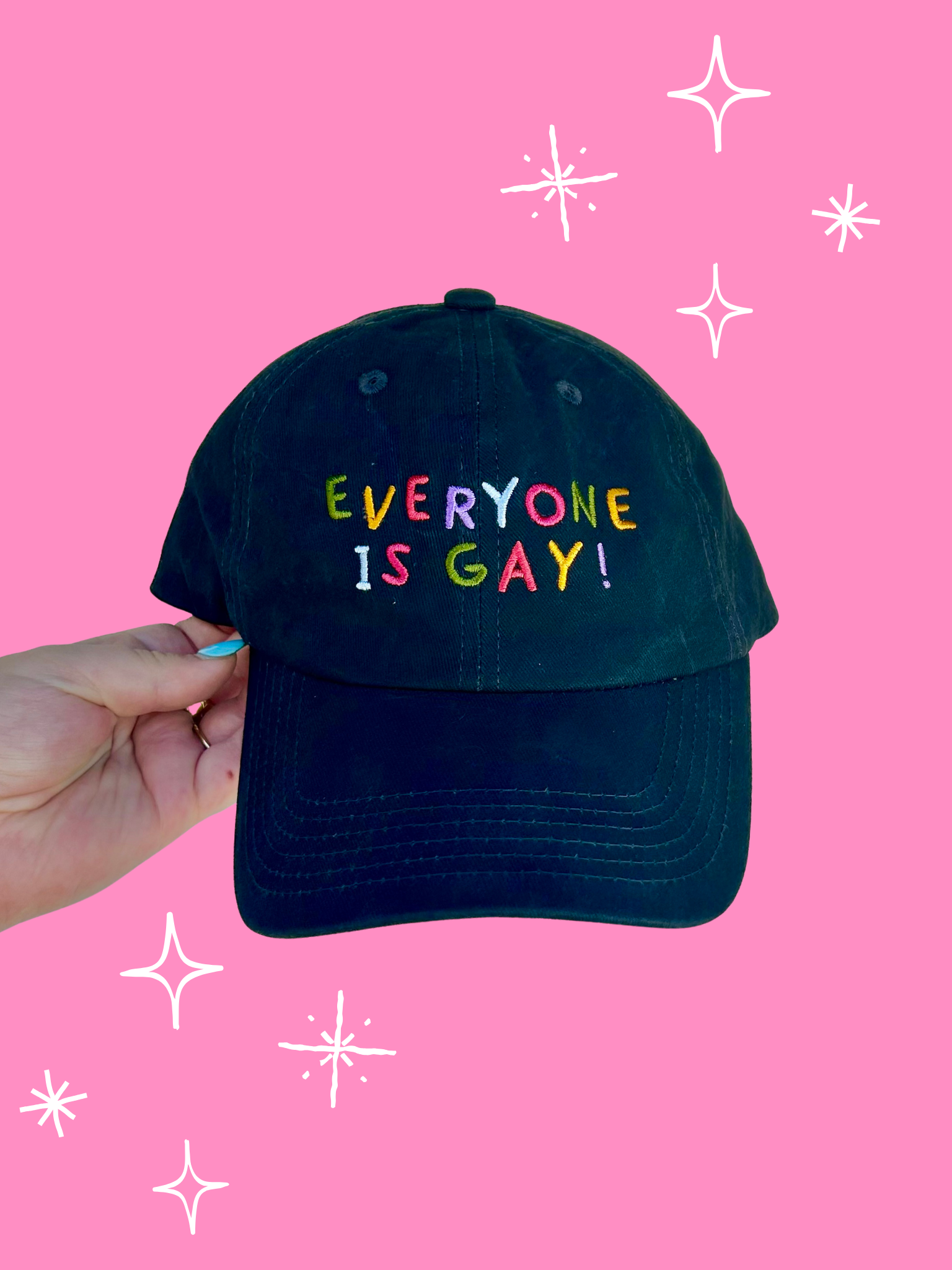 Black cap with 'EVERYONE IS GAY!' text on a pink background