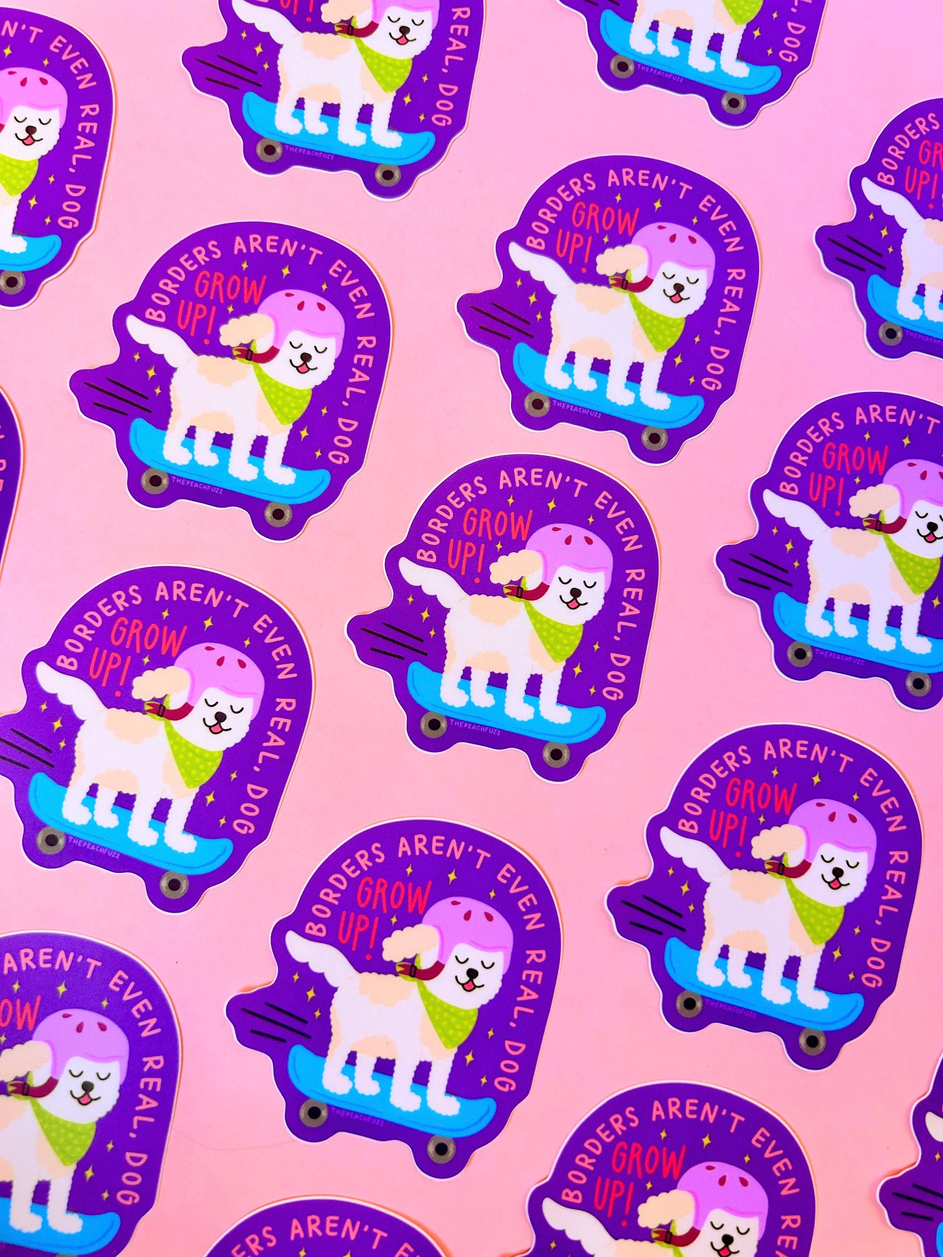 Pattern of cartoon dogs on skateboards with text on a pink background borders aren't even real dog grow up