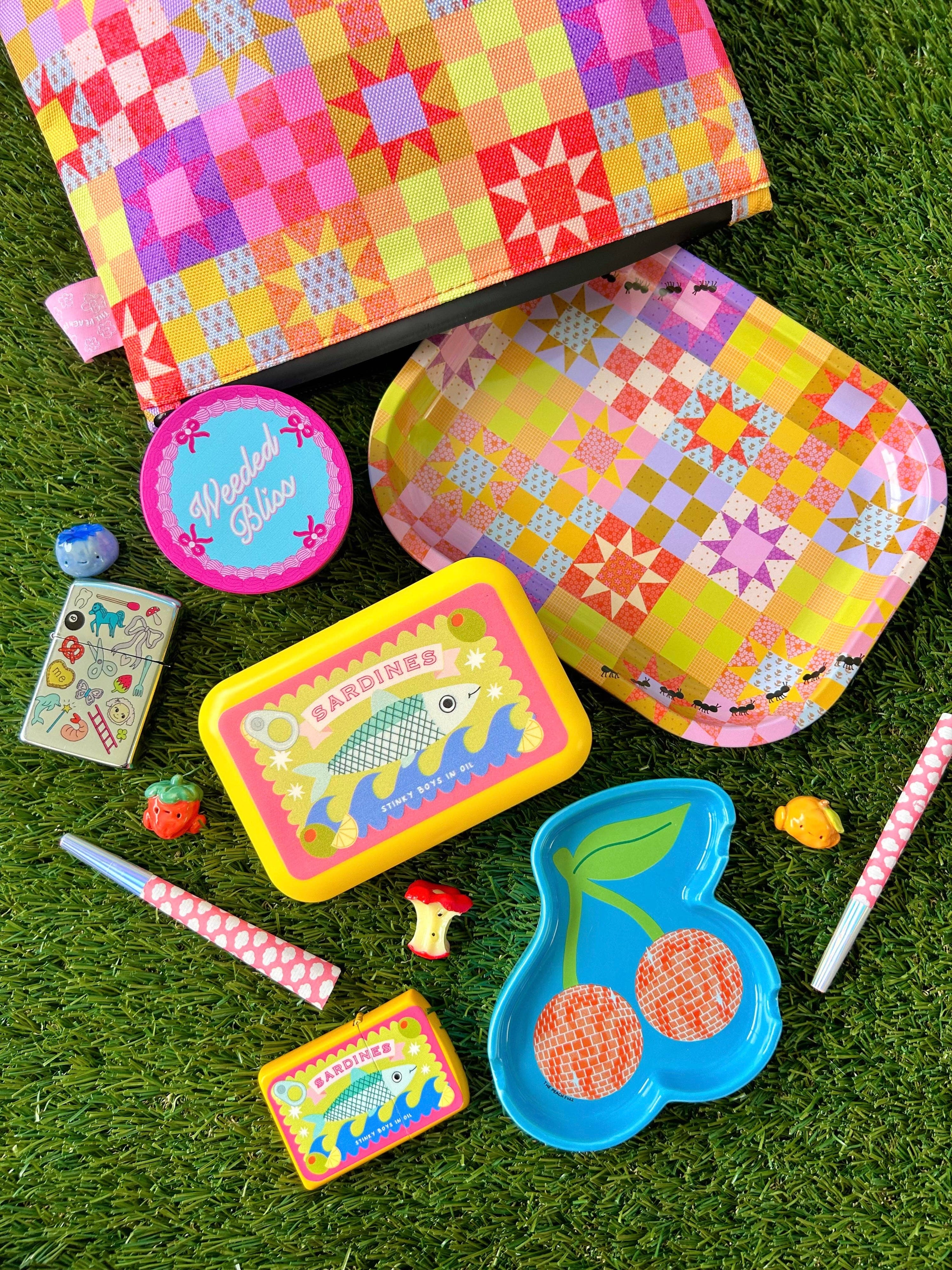 Colorful quilting set with various items on grass