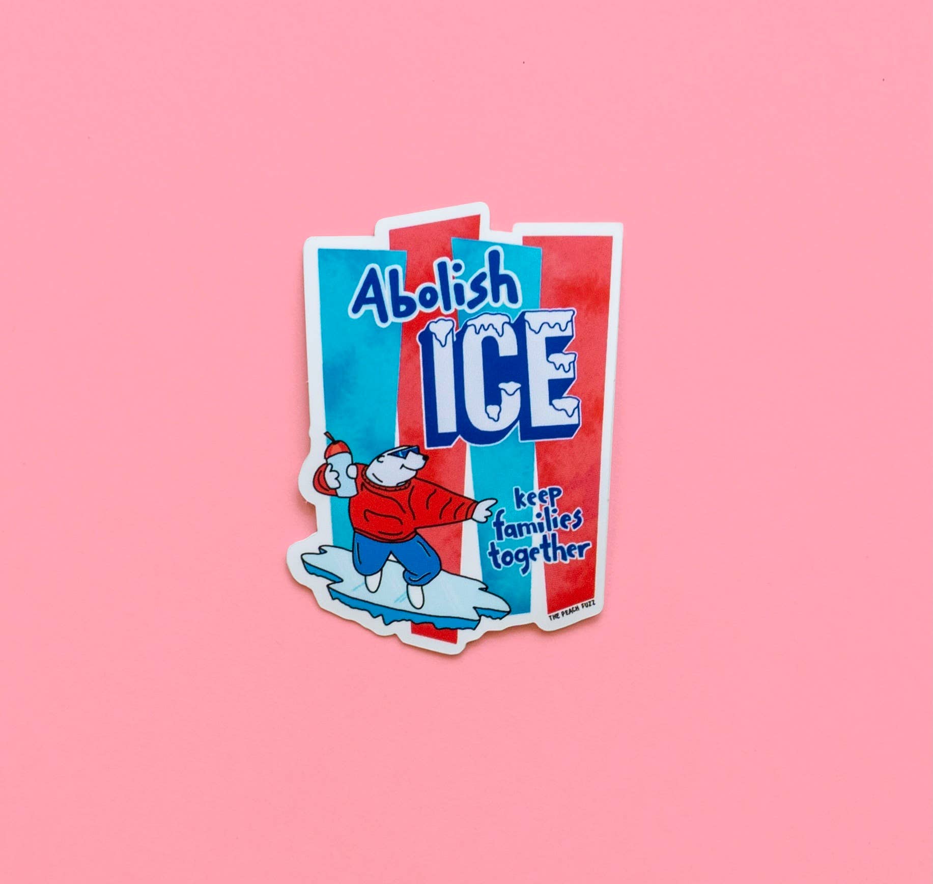 Sticker with a bear cartoon character and text 'Abolish ICE' on a pink background