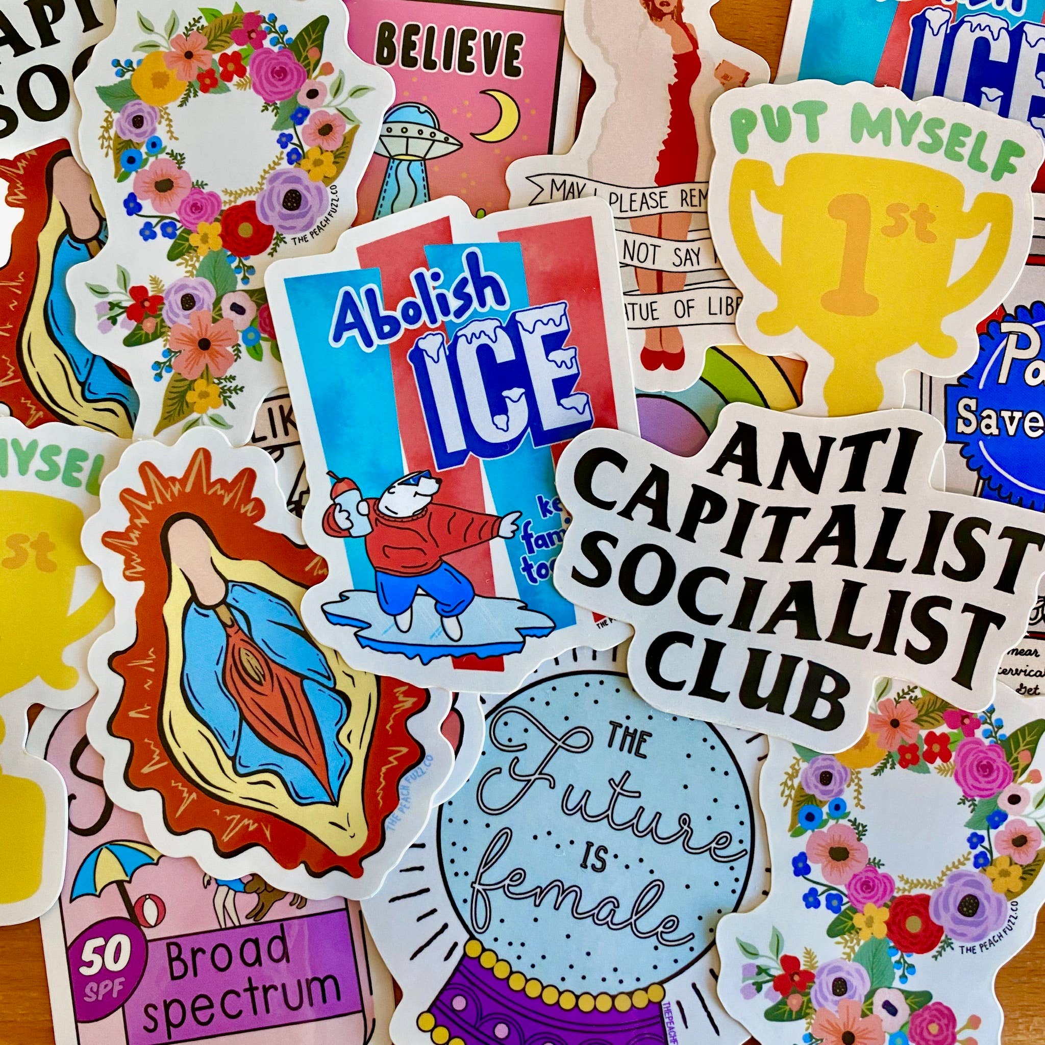 Collection of colorful stickers with various designs and text from Peach Fuzz
