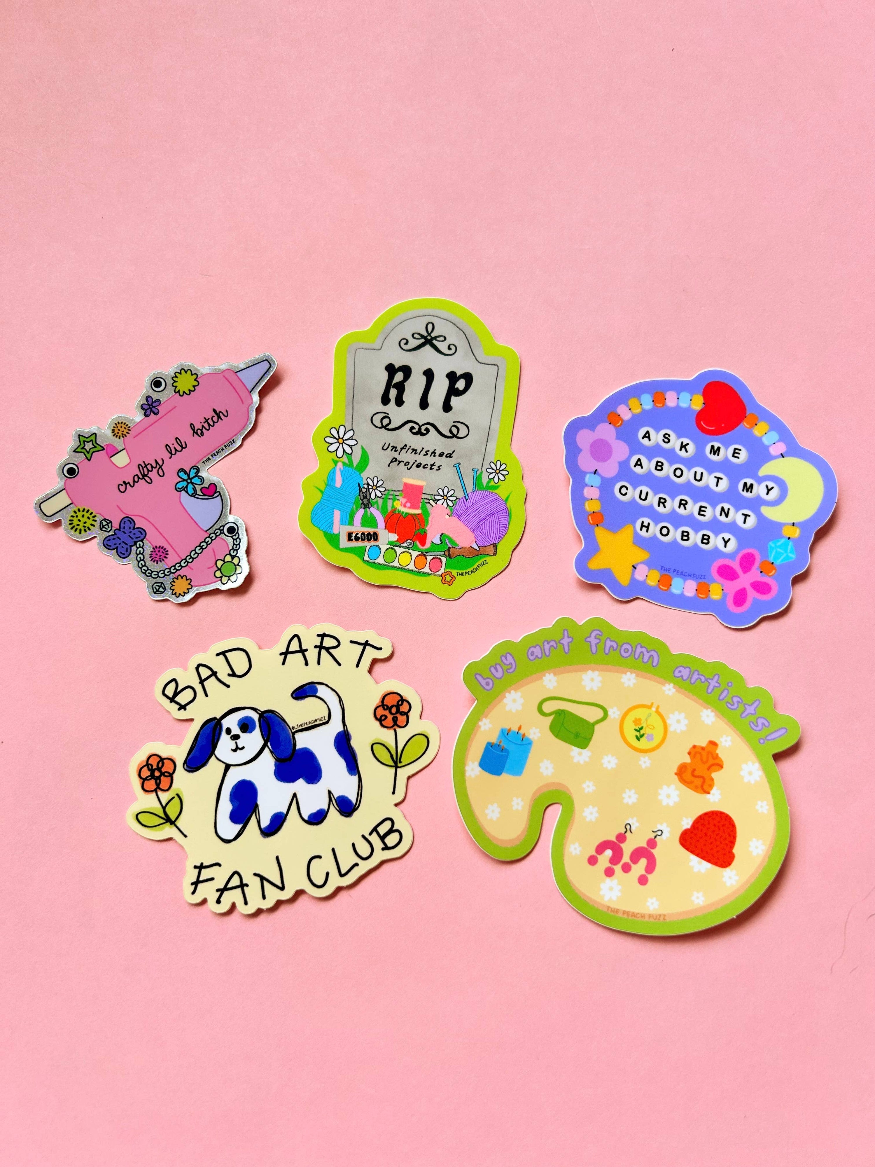 Set of colorful crafting stickers on a pink background