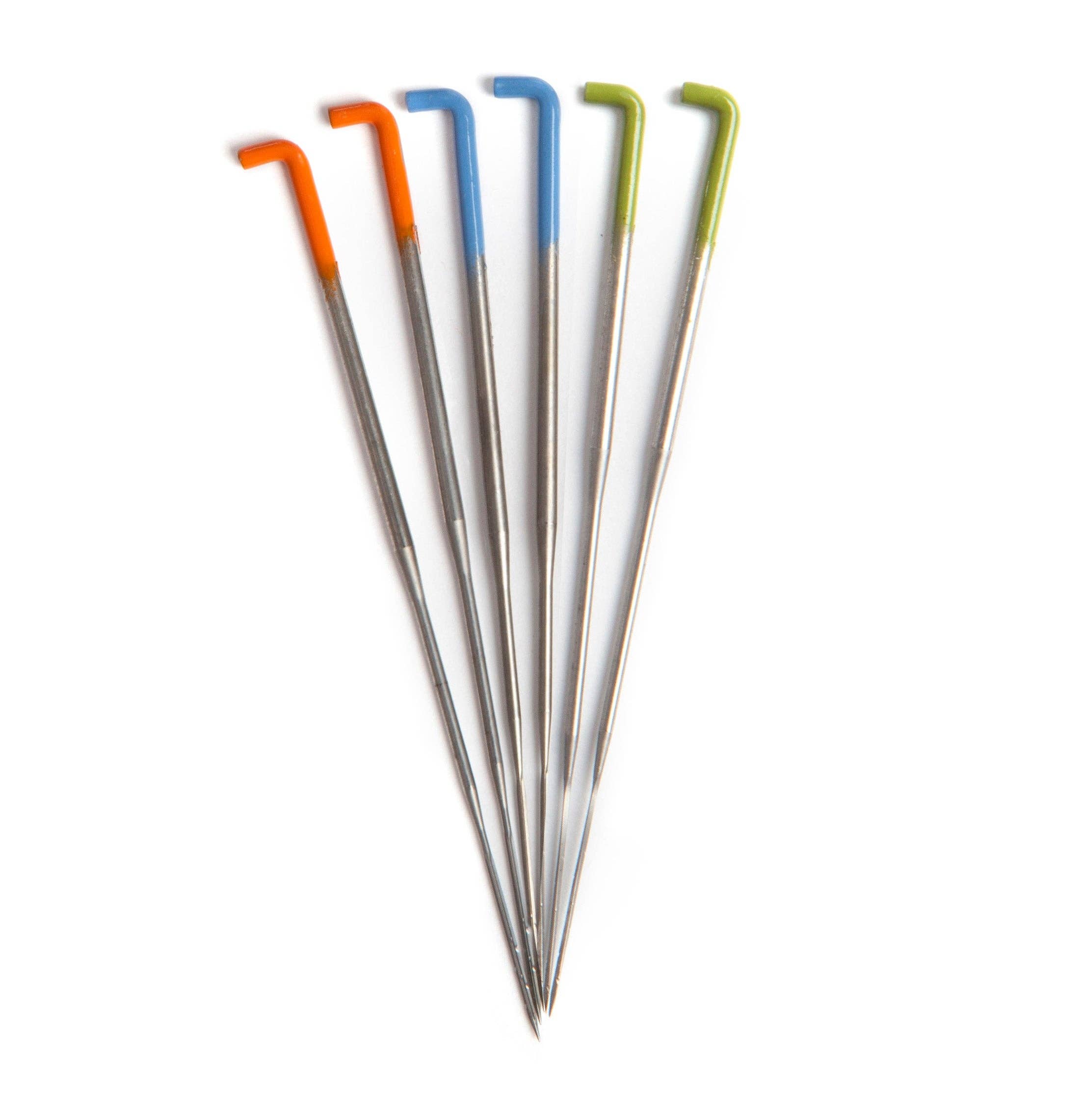 Set of needle felting needles with colorful tips on a white background