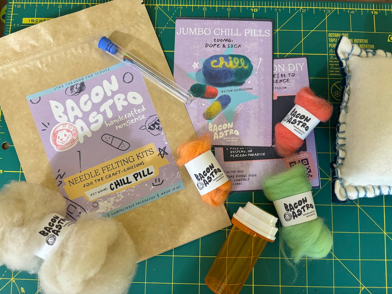 a layout of the chill pill needle felting kit with the wool, needles and felting 