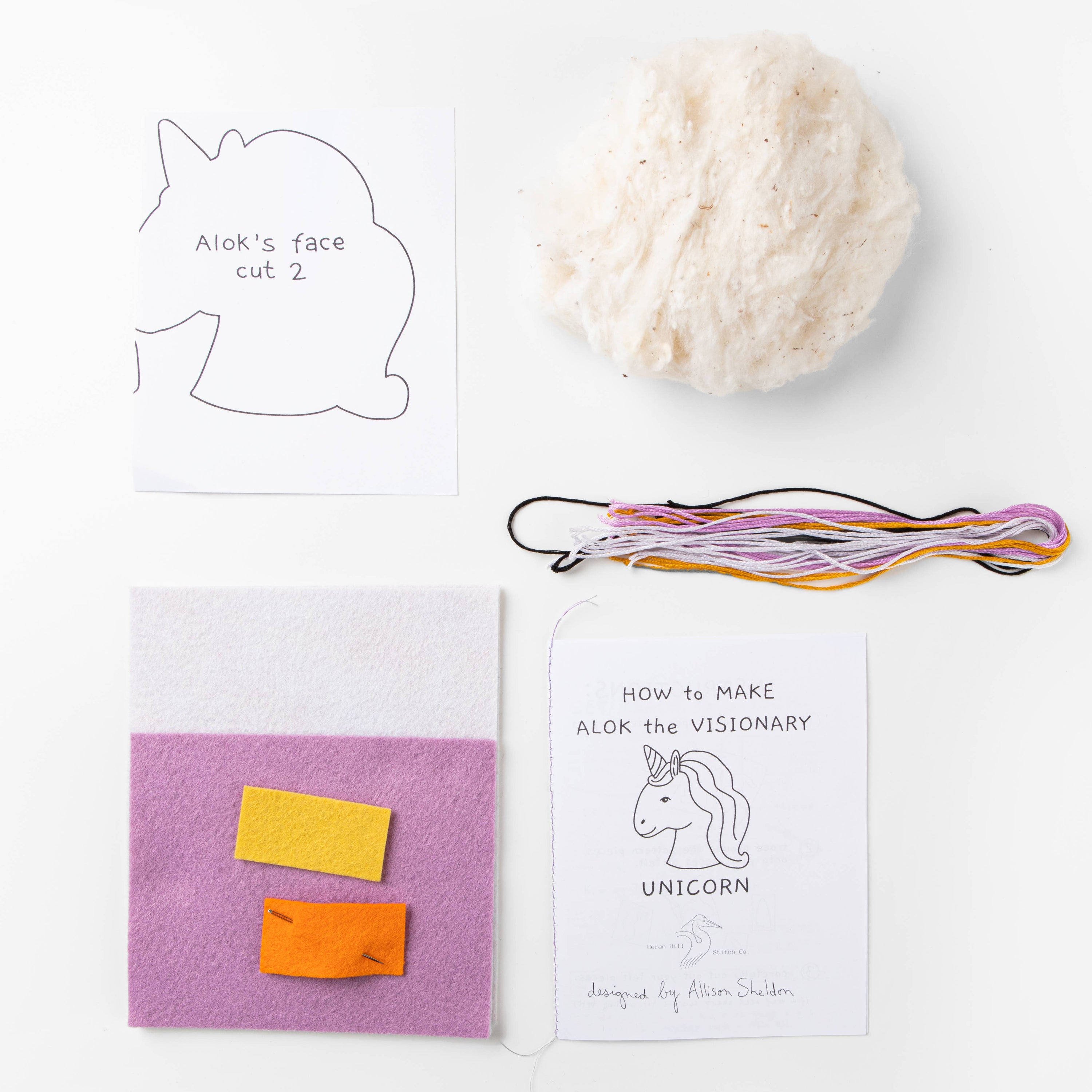 Crafting materials and instructions for creating a unicorn-themed project on a white background