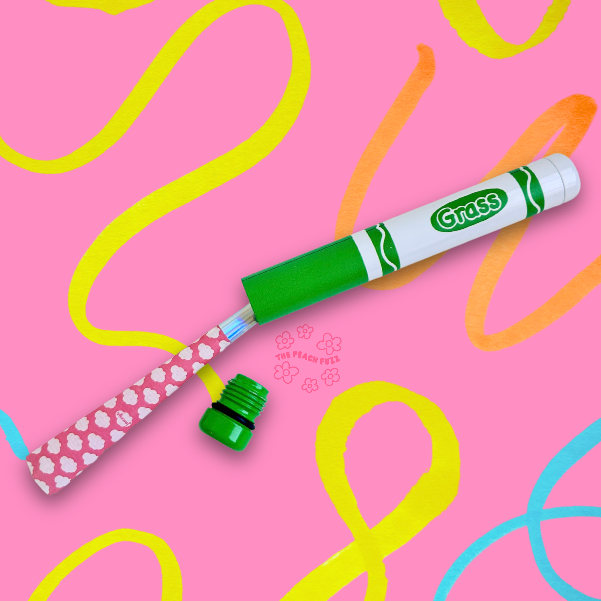 Green marker with a pink joint on a pink background with colorful squiggles