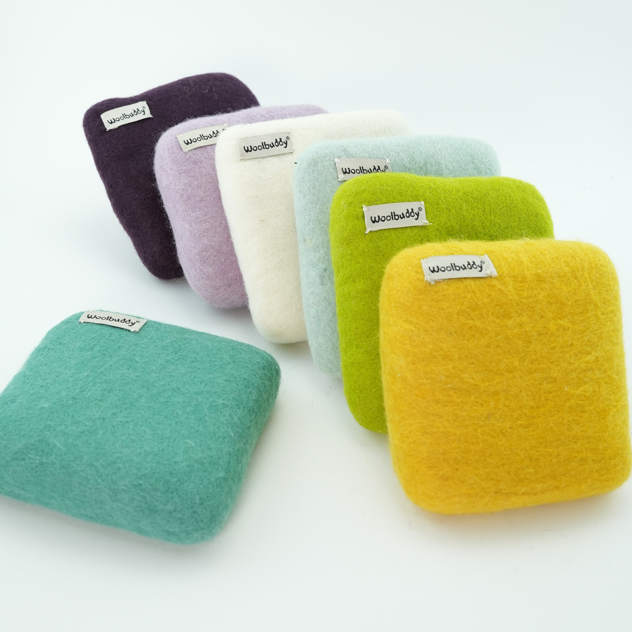 Set of colorful square felt products with 'woolbuddy' label on a white background